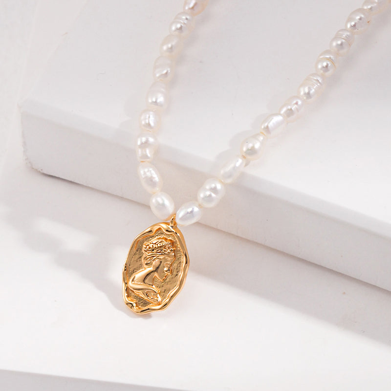 Golden Bust Pendant on Rice Pearl Necklace